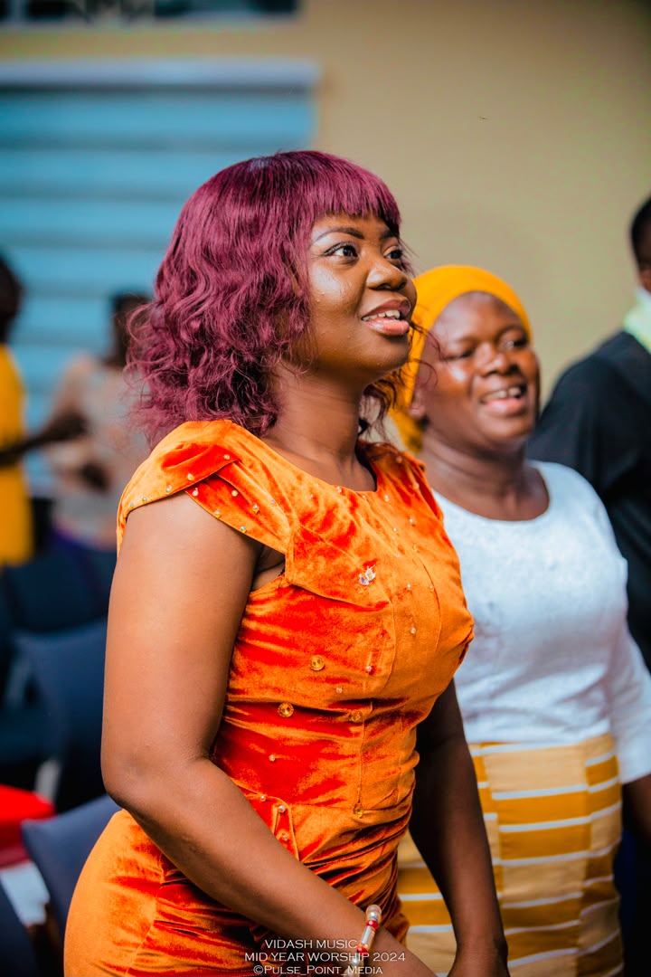 Minister Vida laughing and looking upward during Mid-Year Worship 2024.